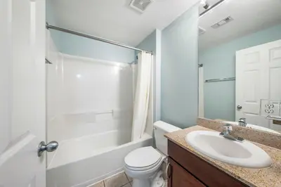 a bathroom with a sink and a toilet and a shower at Laketown Wharf #0201 in Panama City Beach