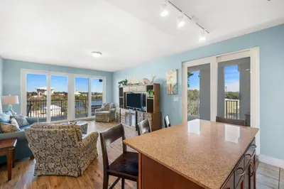 a kitchen and living room with a view of a living room at Laketown Wharf #0201 in Panama City Beach