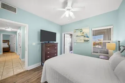 a bedroom with a bed and a flat screen tv at Laketown Wharf #0201 in Panama City Beach