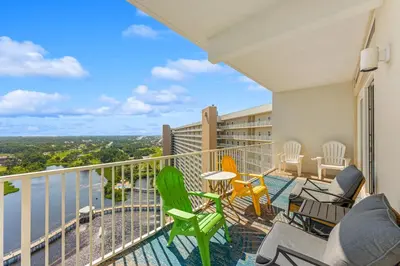 a balcony with chairs and a view of the water at Laketown Wharf #2030 in Panama City Beach