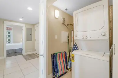 a laundry room with a washer and dryer at Grand Panama #1-1001 in Panama City Beach