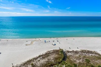 a group of people on a beach with the ocean at Grand Panama #1-1308 in Panama City Beach