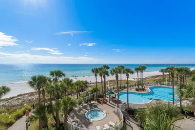 an aerial view of a resort with a swimming pool and the beach at Grand Panama #1-0408 in Panama City Beach