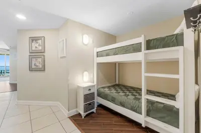 a bedroom with bunk beds in a house at Grand Panama #1-1903 in Panama City Beach