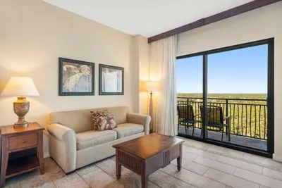 a living room with a couch and a table at Origin #1215 in Panama City Beach