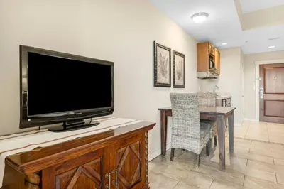 a flat screen tv sitting on top of a wooden entertainment center at Origin #1215 in Panama City Beach