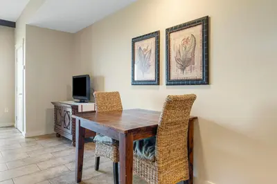 a dining room with a wooden table and chairs at Origin #1215 in Panama City Beach