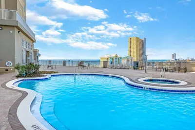 a swimming pool with a view of the ocean at Grand Panama #2-0603 in Panama City Beach