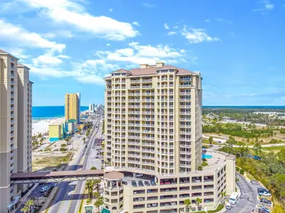 an aerial view of a building with the ocean in the background at Grand Panama #2-0603 in Panama City Beach