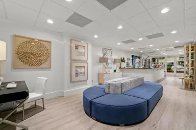 a store with a blue ottoman in a room at Grand Panama #2-0603 in Panama City Beach