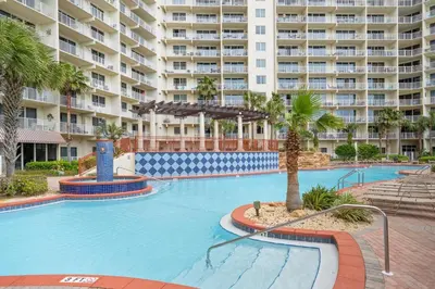 a large swimming pool in front of a large apartment building at Shores Of Panama #1412 in Panama City Beach