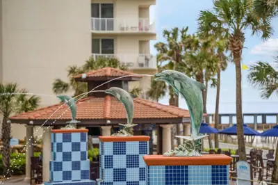 two statues of birds on a table at a resort at Shores Of Panama #0220 in Panama City Beach