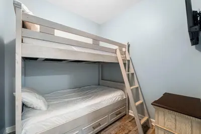 a bedroom with a bunk bed with a ladder at Shores Of Panama #0220 in Panama City Beach