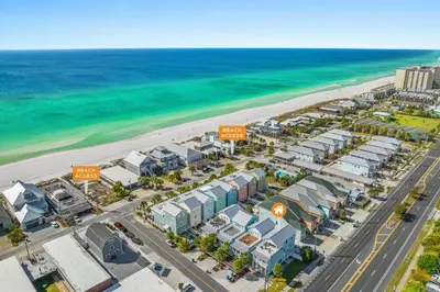 an aerial view of a resort near the beach at Spectacular 3br 4ba w/ Private Pool, 2 Min Walk to Beach - Sleeps 15! in Panama City Beach