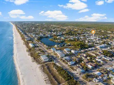 an aerial view of a beach and a city at Laguna Peach: 3BA 2BA retreat for 10! Explore nearby beaches & activities in Panama City Beach