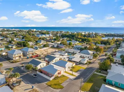 an aerial view of a small town next to the ocean at Laguna Peach: 3BA 2BA retreat for 10! Explore nearby beaches & activities in Panama City Beach