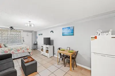 a living room with a couch and a table at Fontainebleau Terrace #400 by Book That Condo in Panama City Beach