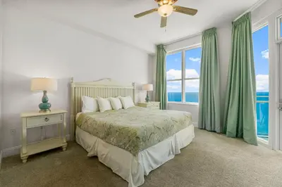 a bedroom with a bed and a large window at Aqua #2209 in Panama City Beach