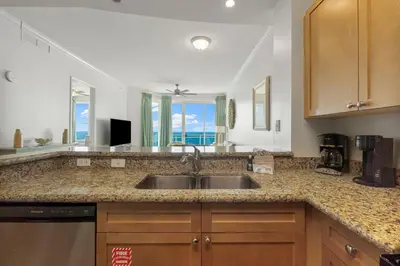 a kitchen with a sink and a counter top at Aqua #2209 in Panama City Beach