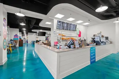 a fast food restaurant with blue floors and a counter at Calypso #3-607 in Panama City Beach