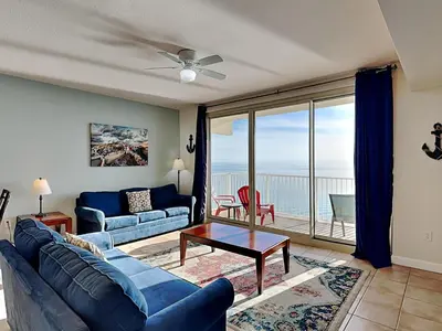 a living room with a couch and a table at Shores of Panama #1702 in Panama City Beach