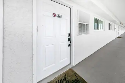 a white garage door with a no parking sign on it at The Summit 1426 in Panama City Beach