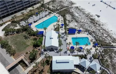 an aerial view of a resort with two pools at Dunes of Panama E605 2BR 2BA BEACHFRONT condo in Panama City Beach