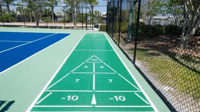 a tennis court with a tennis court at Dunes of Panama E605 2BR 2BA BEACHFRONT condo in Panama City Beach