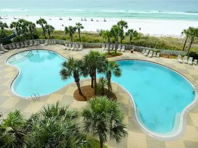 an overhead view of a swimming pool next to the beach at Sterling Beach #1206 in Panama City Beach
