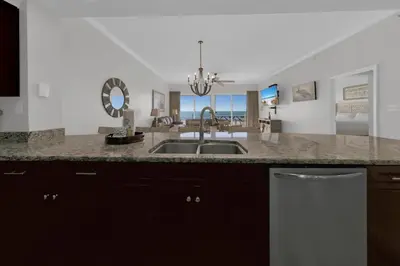 a kitchen with a sink and a counter top at Sterling Beach #406 in Panama City Beach