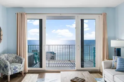 a living room with a view of the ocean at Laketown Wharf #1824 in Panama City Beach