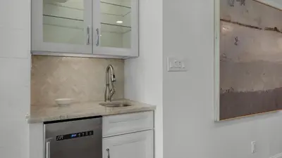 a white kitchen with a sink and a dishwasher at BeachCrest 302 Wave and Sea in Santa Rosa Beach