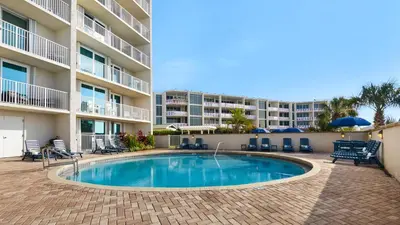 a swimming pool in front of a apartment building at BeachCrest 302 Wave and Sea in Santa Rosa Beach
