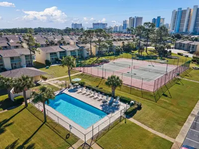 an aerial view of a tennis court and a pool at Gulf Highlands 219 by Book That Condo in Panama City Beach
