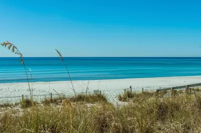 a sandy beach with the ocean in the background at Ocean Reef 704 in Panama City Beach