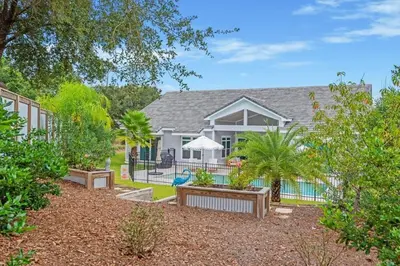a house with a yard with a swimming pool at SOUTHERN SEABREEZE 5BR POOL & BEACH by Barclé in Rosemary Beach