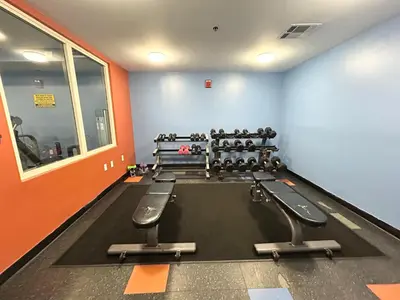 a gym with rows of exercise equipment in a room at Amazing views! Great beachfront Panama City Condo in Panama City Beach