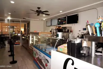 a fast food restaurant with a ceiling fan at Amazing views! Great beachfront Panama City Condo in Panama City Beach