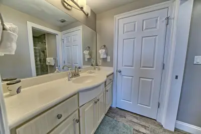 a bathroom with a sink and a mirror at Oceanfront Paradise in Gated Community - 2304 condo in Panama City Beach