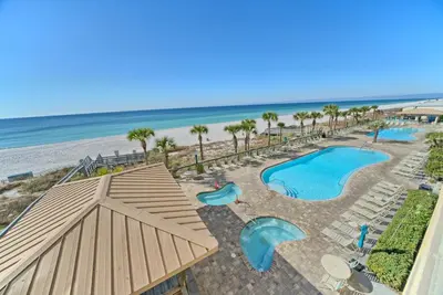 an aerial view of a resort with a pool and the beach at Oceanfront Retreat with Panoramic Views - 0301 condo in Panama City Beach