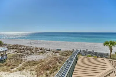 a view of the beach from the balcony of a condo at Oceanfront Retreat with Panoramic Views - 0301 condo in Panama City Beach