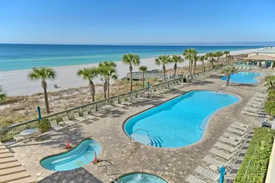 an overhead view of a swimming pool and the beach at Oceanfront Retreat with Panoramic Views - 0301 condo in Panama City Beach