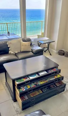 a living room with a couch and a table at Seaside Bliss in Gated Community - 1504 condo in Panama City Beach