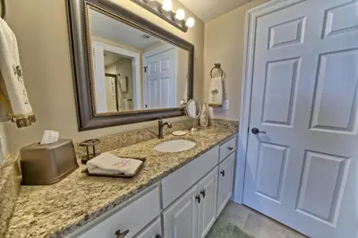 a bathroom with a sink and a mirror at Oceanfront Paradise with Pool Access - 0606 condo in Panama City Beach