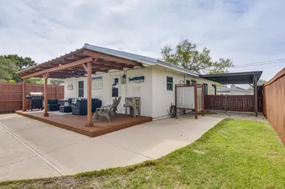 a pergola on a patio in a yard at Panama City Beach Home with Private Pool and Gas Grill in Panama City Beach