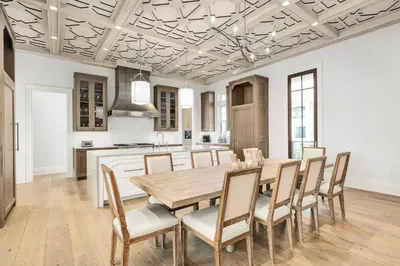 a dining room with a wooden table and chairs at Seaclusion at Seagrove in Santa Rosa Beach