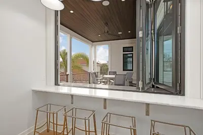 a room with chairs and a counter with mirrors at Seaclusion at Seagrove in Santa Rosa Beach
