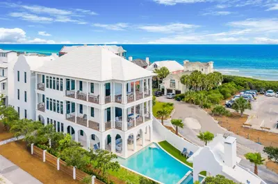 an aerial view of a house with a pool and the ocean at Sanctuary at Seagrove in Santa Rosa Beach