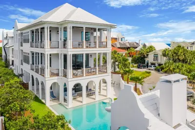 an aerial view of a large white house with a pool at Sanctuary at Seagrove in Santa Rosa Beach