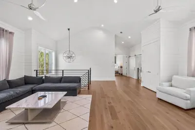 a living room with a couch and a table at Casa al Mare in Santa Rosa Beach